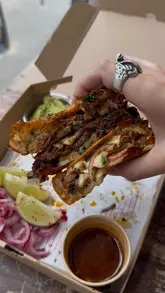 A creator visits a gluten-free pop-up stall called Hermanos Caliente located at Trinity Kitchen in Leeds, showcasing their tacos, nachos, and gluten-free beer options.
