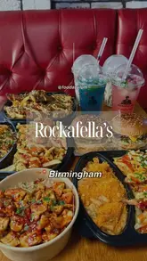 A fast-paced, visually engaging reel showcasing various 'Trap boxes,' rice boxes, burgers, and mocktails from Rockafella's in Birmingham. The video uses quick cuts and close-ups to highlight the textures and presentation of the food.