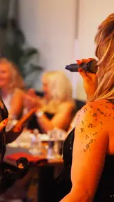 A montage video showcasing a Tina Turner tribute night at Isabel's Brasserie. The video features clips of the venue, welcome drinks, canapés, a main course, dessert, and the live performance with guests dancing.