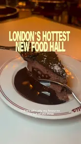 A couple visits the Arcade food hall in Covent Garden, showcasing various dishes including pizza, fried chicken, a burger, and chocolate cake, while highlighting the lively atmosphere and DJ.