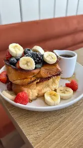 A montage of high-quality, aesthetic shots featuring various brunch items including a matcha latte, coffee, French toast, and salmon toast at a cafe in Fulham.