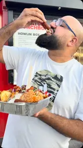 A review of a Nashville hot chicken food truck in Birmingham, featuring a variety of items including a burger, tenders, taco, and waffle chips. The creator enthusiastically samples the food, highlighting the flavors and textures.