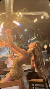 A promotional video for a new Turkish restaurant in Liverpool, showcasing the venue's interior, live entertainment including fire and belly dancers, and a selection of Turkish dishes like platters and baklava.