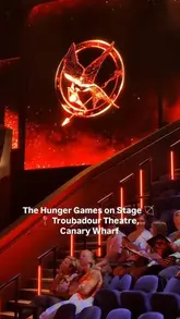 A family vlog showcasing a visit to the Hunger Games stage production at the Troubadour Theatre in Canary Wharf, highlighting the 360-degree stage and performance.