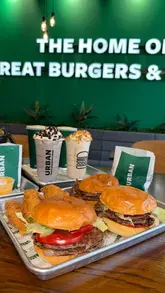 A vlog-style promotional video for Urban Fresh Burgers in Barnsley, showing the journey to the venue, the interior, and a variety of food items including burgers, fries, onion rings, and milkshakes.