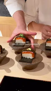 A visually appealing montage showcasing a 22-course sushi omakase experience at Sushi Amamoto, featuring close-up shots of various nigiri, sashimi, and signature dishes like mochi with caviar and trout & kombu oshizushi.