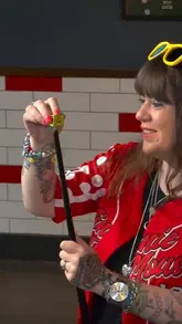 A video still featuring a person at Riley's Sports Bar in Leeds, highlighting the venue's focus on competitive socialising like pool and interactive darts.