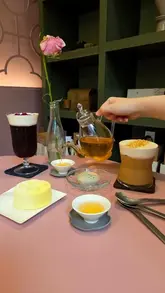 A visually serene tour of a Chinese teahouse in London, highlighting the traditional and modern tea offerings, intricate desserts, and the carefully curated interior design.