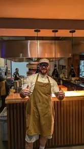 A creator visits Lennox in Manchester, providing a behind-the-scenes look at the kitchen operations and tasting the restaurant's signature dishes.
