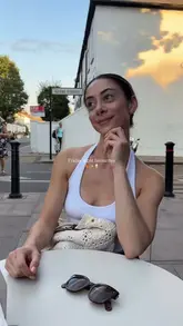 The video follows a creator on a Friday night out, starting with a visit to a pizza restaurant for hot honey pepperoni pizza, followed by a stop for gelato, and ending with a scenic walk along the river.