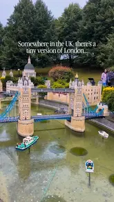 A static shot of the Miniland section at Legoland Windsor, featuring a model of Tower Bridge. The image captures the miniature scale of the attraction under an overcast sky.