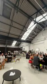A vlog-style review of 'Local HQ', a new, spacious coffee and events venue located in Benfield Business Park. The creator tours the industrial-style space, highlights the food and drink menu, and discusses the venue's future plans for events and collaborations.