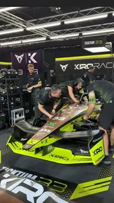 The creator attends the Formula E race in London, providing a behind-the-scenes look at the event, the race cars, and the pit crew, while also reviewing food from vendors Baked Bird and Electric Lounge.