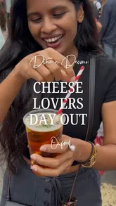 A couple explores the Dine n Devour food market in Oxford, focusing on a 'cheese crawl' theme. They sample various street food items including corn dogs, mac and cheese, crepes, and doughnuts, while highlighting the market's atmosphere and upcoming return.