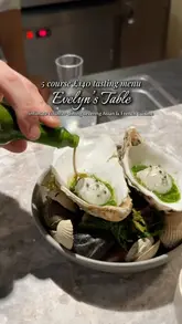 A high-quality showcase of a tasting menu at Evelyn's Table, featuring close-up shots of intricate plating, including langoustine, lobster, wagyu, and truffles.