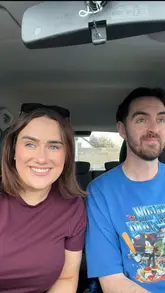 A couple vlogs their shopping trip to a 'Fancy Dunnes' store, showcasing food items, home decor, and clothing, while discussing their budget and shopping habits.