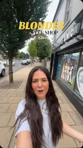 A creator visits and reviews a newly opened coffee shop called 'Blondes' in Kilrea, Northern Ireland, which is uniquely situated in a former petrol station. The video provides a tour of the interior and exterior seating areas, showcases the coffee and various baked goods like cinnamon rolls and cookies, and highlights the shop's atmosphere.