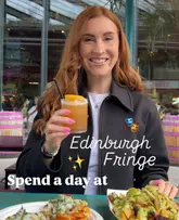 A creator poses with a cocktail and street food at the Edinburgh Fringe festival, highlighting the casual, vibrant atmosphere of the event.