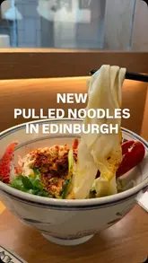 A short review of Noodle Meet Changan in Edinburgh, highlighting their freshly pulled noodles and open kitchen concept. The video features the noodle-making process and a close-up of their signature lobster noodle dish.