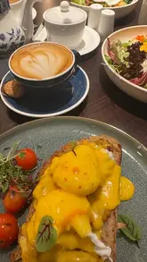 A montage showcasing the interior and various breakfast and brunch dishes, including croffles and specialty coffees, at Mantra Thai.