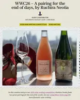 A promotional image for a wine writing competition entry, featuring two bottles of sparkling wine and a wine glass, set against a blurred city skyline with a pair of red high heels as a stylistic prop.