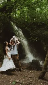 A short, aesthetic montage featuring a couple and their baby visiting Harmby Waterfall in Yorkshire. The video captures the walk to the waterfall and various shots of the couple posing in front of the cascade.