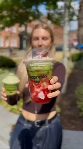 A creator visits Teapresso to showcase their matcha and bubble tea offerings, highlighting the customization options available via their ordering kiosk and the preparation of the drinks.