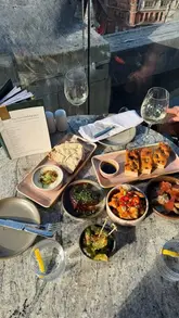 A promotional reel for the King Street Wine Mile in Manchester, specifically highlighting The Rex. The video showcases the rooftop setting, wine selection, and various small plates, encouraging viewers to visit for the summer offer.