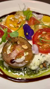 A montage of various dishes served at La Velvetta, including starters, mains, and desserts, presented as a visual showcase of the menu.
