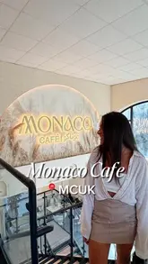 A short, aesthetic reel featuring a visit to Monaco Cafe, showcasing the interior, various dishes including steak and pasta, and drinks.