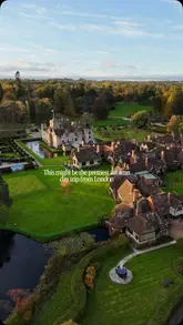 An aerial drone shot of Hever Castle in autumn, showcasing the historic building, surrounding gardens, and lake. The image is used to promote the location as a scenic day trip or overnight stay destination from London.