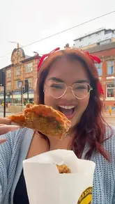 A creator visits Ji Chicken in Sheffield to showcase their crispy fried chicken skin, highlighting the menu and seasoning options before performing a taste test.