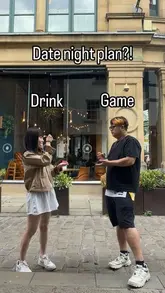 A couple visits NQ64 arcade bar in Manchester, showing off the neon-lit atmosphere, retro arcade games, and themed cocktails.