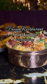 A montage video showcasing the interior and food offerings of Amiri Lounge, an Indian-Turkish fusion restaurant. The video features shots of the plush, moody decor, various curry dishes, grilled meats, and cocktails.