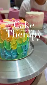 A promotional video for a cake decorating studio, showing the process of icing and decorating a bento cake.