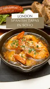 A fast-paced, engaging reel showcasing a variety of Spanish tapas dishes, drinks, and the lively atmosphere at Brindisa Tapas in Soho, London.