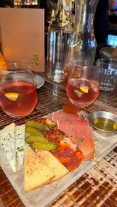 A review of El Gato Negro Tapas, highlighting their 3 for £20 offer, August specials, and overall atmosphere.