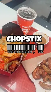 A promotional video for the opening of a new Chopstix Noodle Bar in Trinity Square, featuring shots of the interior, the food counter, and various menu items like noodles, chicken, dumplings, and bao.