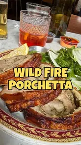 A creator visits Wild Fire in Deptford, Sunderland, to review their new Sunday-only Porchetta Romana roast, while also highlighting their pizza and tiramisu.