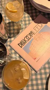 A promotional reel showcasing the interior, food, and drink offerings of the newly opened Dishoom in Leeds. The video features quick cuts of the restaurant's decor, cocktail preparation, kitchen staff, and various dishes.