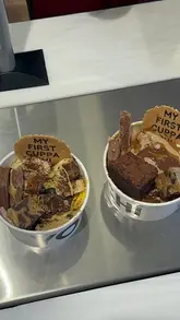 A montage showing the process of creating a custom frozen yogurt bowl at Yochi, featuring various yogurt flavors and a wide selection of toppings, sauces, and garnishes.
