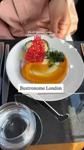 A promotional video for Bustronome London, a double-decker bus restaurant with a glass roof. The video features a montage of the bus interior, views of iconic London landmarks, and a 4-course lunch service.