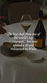 A high-end, 10-seat chef's table experience at Palé Hall in North Wales, featuring a 10-course tasting menu with wine pairings, showcasing the chefs at work and the intimate dining atmosphere.