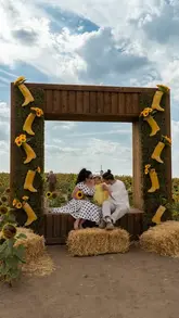 A montage of a mother and child visiting a sunflower field, showcasing the photo opportunities and the experience of walking through the flowers.