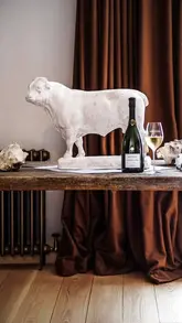 A cinematic montage showcasing the Ashcombe Estate, featuring luxury accommodation, scenic countryside views, and an open-fire dining experience at WildKitchen, paired with Bollinger champagne.