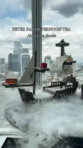 A promotional video for the Peter Pan-themed afternoon tea at Aqua Shard in London. The video features close-up shots of the themed food items, including a smoking boat presentation and a treasure chest for scones, set against the backdrop of the London skyline from the 31st floor.