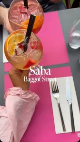 A montage of food, cocktails, and outdoor dining at Saba on Baggot Street, featuring close-ups of dishes and drinks.