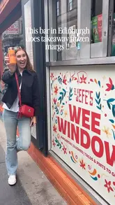 A short, energetic video showcasing a takeaway frozen margarita service from a venue called El Jefe's in Edinburgh. The creator demonstrates the process of getting the drink from the 'Wee Window' and enjoys the product on the street.