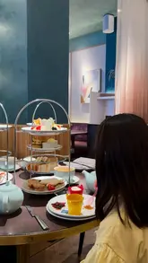 A promotional reel for a seaside-themed afternoon tea experience at the DoubleTree by Hilton London Victoria, featuring children enjoying the themed treats and adults having their own selection.