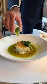 A short, polished reel showcasing an 8-course tasting menu at Galvin La Chapelle, a restaurant located in a converted church. The video features high-quality shots of the dining room, wine service, and various plated dishes, accompanied by text overlays describing the experience.